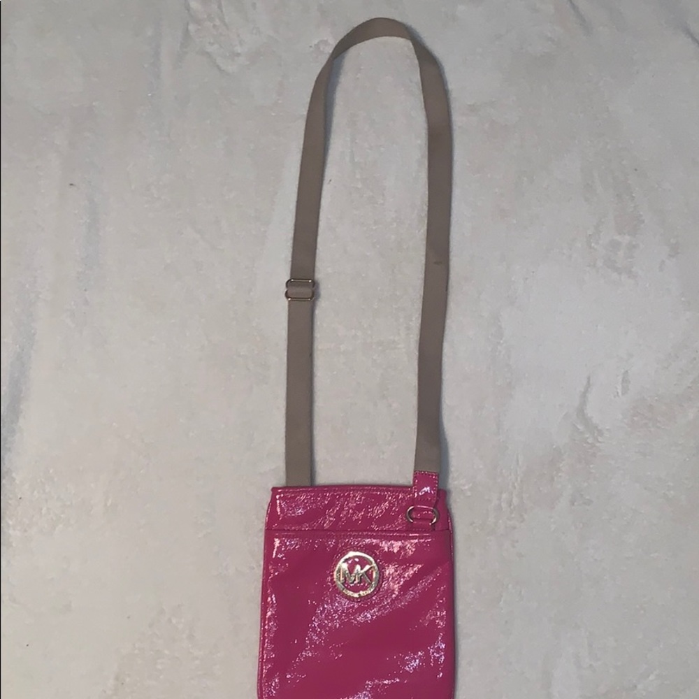 A pink MK cross body